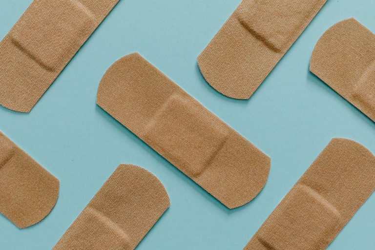 Brown bandages on a blue background.